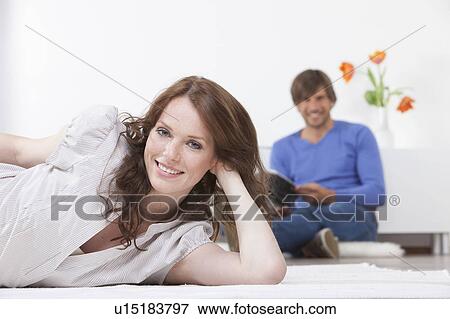 Portrait of woman on rug man reading View Large Photo Image Stock Photo - Portrait of woman on rug man reading. Fotosearch