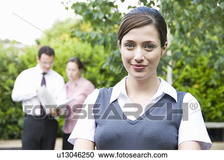 Portrait of women with co workers View Large Photo Image Stock Image - Portrait of women with co workers. Fotosearch