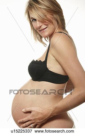 Stock Photo - Pregnant woman, smiling. Fotosearch