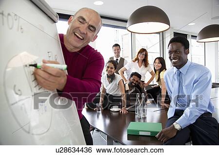 Presentation during business meeting View Large Photo Image Stock Photograph - Presentation during business meeting. Fotosearch