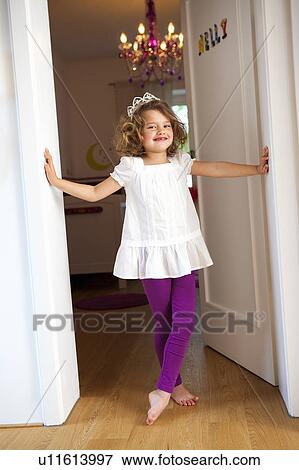 Stock Photo - Princess girl at her room door. Fotosearch