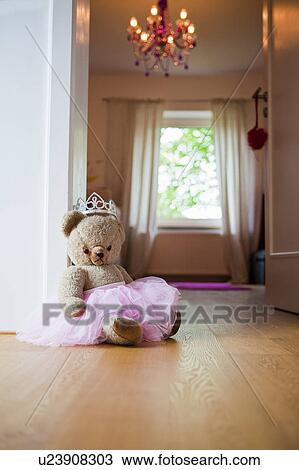 Stock Image - Princess teddy bear in girls room. Fotosearch