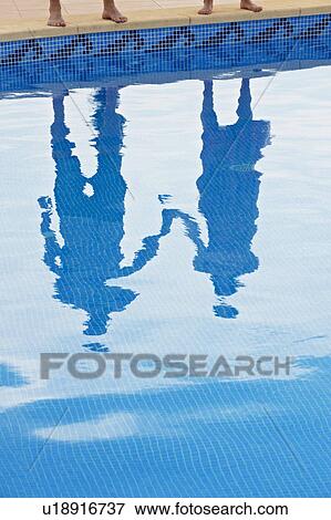 Reflection of couple holding hands View Large Photo Image Stock Photo - Reflection of couple holding hands. Fotosearch