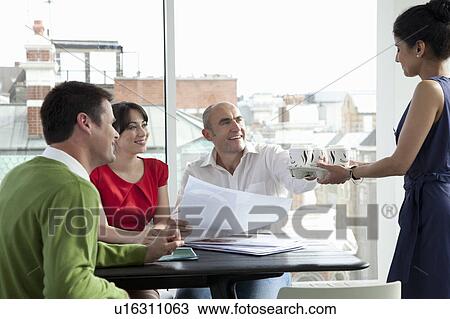 Stock Image - Relaxed business meeting. Fotosearch
