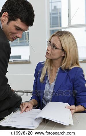 Reviewing a client prospect View Large Photo Image Stock Image - Reviewing a client prospect. Fotosearch