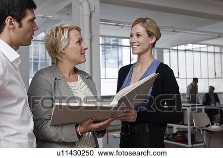 Reviewing prospects at the office View Large Photo Image Stock Image - Reviewing prospects at the office. Fotosearch