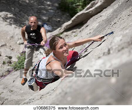 Rock climber climbing rock face View Large Photo Image Stock Photography - Rock climber climbing rock face. Fotosearch