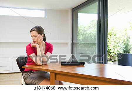 Stock Photo - Sad business woman deep in thought. Fotosearch