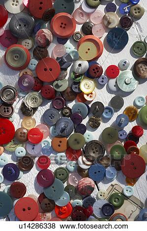 Stock Photo - Scattered colourful buttons. Fotosearch