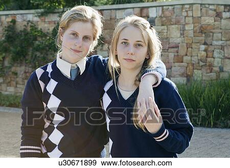 Stock Photo - School girl's holding hands. Fotosearch