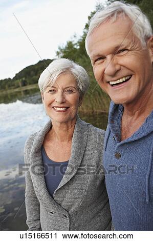 Senior couple in front of lake View Large Photo Image Stock Image - Senior couple in front of lake. Fotosearch