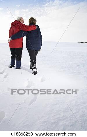 Stock Image - Senior couple in the snow. Fotosearch