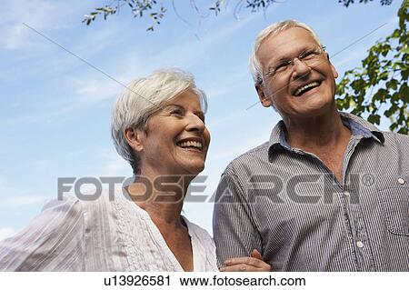 Senior couple outdoors View Large Photo Image Stock Image - Senior couple outdoors. Fotosearch