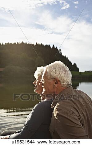 Senior couple relaxing View Large Photo Image Picture - Senior couple relaxing. Fotosearch