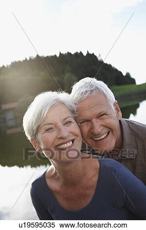 Senior couple smiling to camera View Large Photo Image Stock Photography - Senior couple smiling to camera. Fotosearch