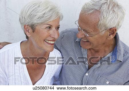 Senior couple smiling to each other View Large Photo Image Picture - Senior couple smiling to each other. Fotosearch