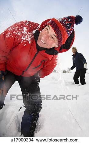 Senior couple throwing snowballs View Large Photo Image Picture - Senior couple throwing snowballs. Fotosearch