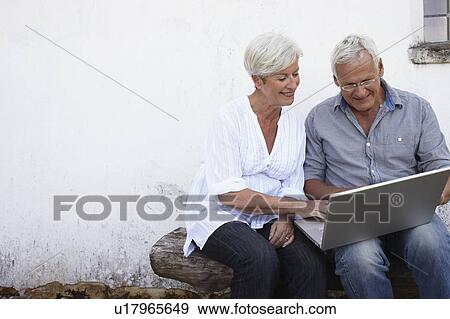 Stock Photo - Senior couple with laptop. Fotosearch