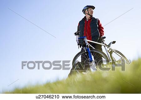 Senior man with mountain bike View Large Photo Image Stock Image - Senior man with mountain bike. Fotosearch