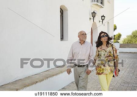 Senior tourists strolling View Large Photo Image Stock Image - Senior tourists strolling. Fotosearch