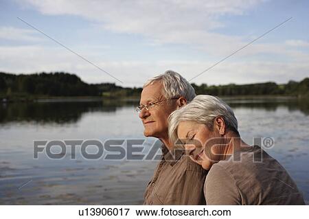 Senior woman lying head on mans shoulder View Large Photo Image Stock Photo - Senior woman lying head on mans shoulder. Fotosearch