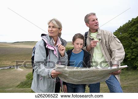 Seniors and granddaughter check map View Large Photo Image Stock Image - Seniors and granddaughter check map. Fotosearch