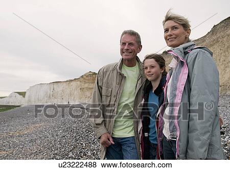 Seniors and granddaughter on beach View Large Photo Image Stock Photo - Seniors and granddaughter on beach. Fotosearch