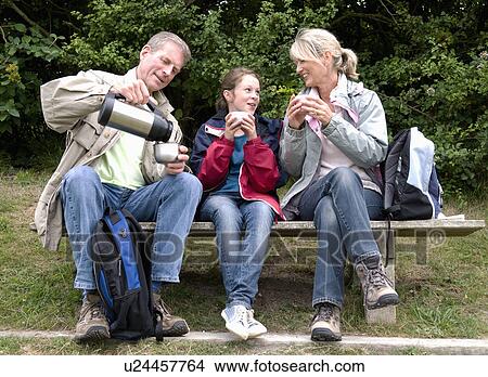 Picture - Seniors and granddaughter take a break. Fotosearch
