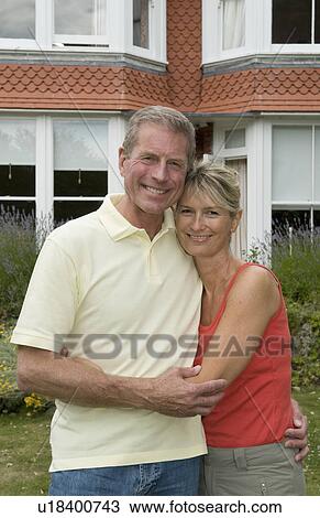 Seniors embrace in family garden View Large Photo Image Stock Image - Seniors embrace in family garden. Fotosearch