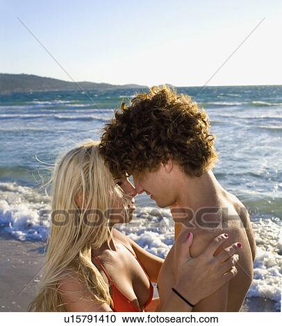 Stock Image - Sexy romantic cple closeup beach. Fotosearch