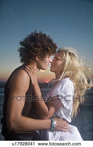 Sexy younc cple at sunset sea View Large Photo Image Stock Image - Sexy younc cple at sunset sea. Fotosearch