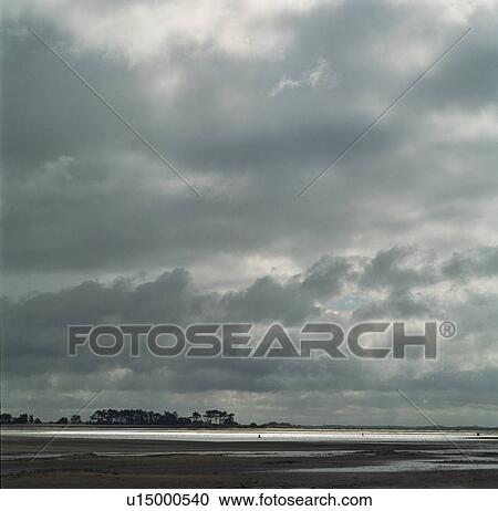 Storm clouds over estuary View Large Photo Image Stock Image - Storm clouds over estuary. Fotosearch