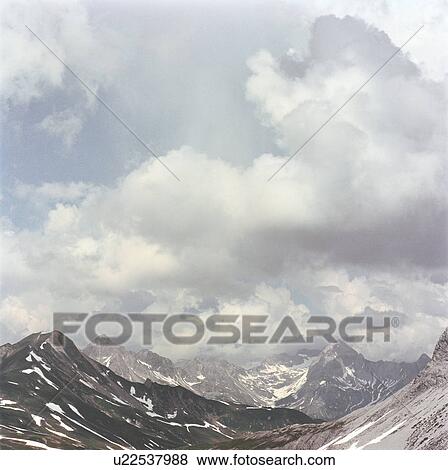 Stock Photo - Storm clouds over mountains. Fotosearch