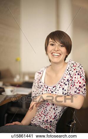 Stock Image - Student girl laughing. Fotosearch