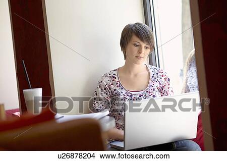 Picture - Student in a cafe. Fotosearch