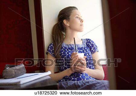 Stock Image - Student in a cafe. Fotosearch