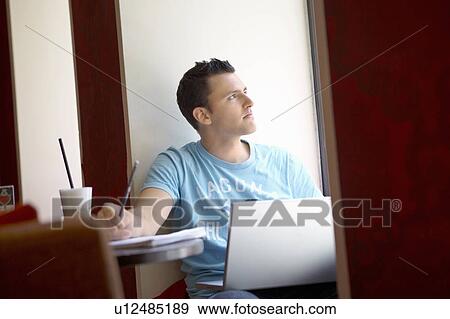 Stock Photo - Student in a cafe. Fotosearch