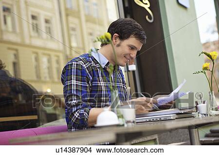 Student studying in a cafe View Large Photo Image Picture - Student studying in a cafe. Fotosearch