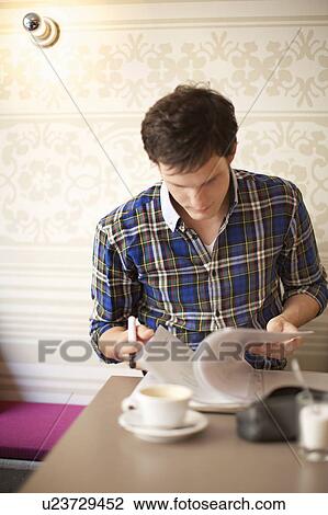 Student studying in a cafe View Large Photo Image Stock Image - Student studying in a cafe. Fotosearch