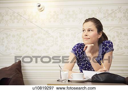 Student studying in a cafe View Large Photo Image Stock Photo - Student studying in a cafe. Fotosearch