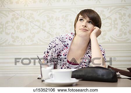Student studying in a cafe View Large Photo Image Stock Photograph - Student studying in a cafe. Fotosearch