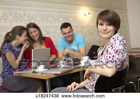 Students studying in a cafe View Large Photo Image Stock Photo - Students studying in a cafe. Fotosearch