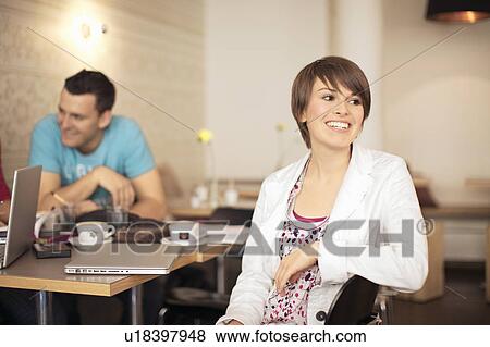 Stock Photo - Students studying in a cafe. Fotosearch