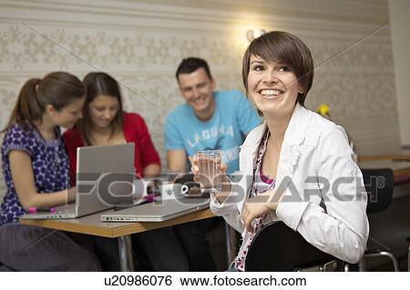 Students studying in a cafe View Large Photo Image Stock Photograph - Students studying in a cafe. Fotosearch