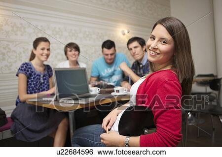 Stock Photograph - Students studying in a cafe. Fotosearch