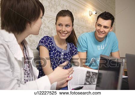 Stock Photography - Students studying in a cafe. Fotosearch