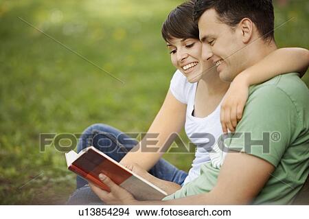 Picture - Students studying outdoors. Fotosearch