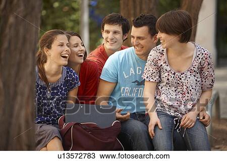 Stock Image - Students studying outdoors. Fotosearch