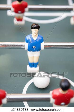 Table football player with ball View Large Photo Image Stock Photo - Table football player with ball. Fotosearch