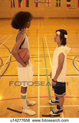 Stock Photo - Tall and short basketball players. Fotosearch